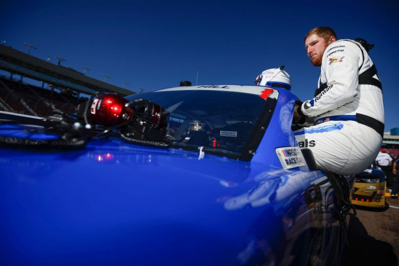 AVONDALE, ARIZONA - MARCH 12: Austin Hill, driver of the #21 United Rentals Chevrolet, enters his car during qualifying for the NASCAR Xfinity Series United Rentals 200 at Phoenix Raceway on March 12, 2022 in Avondale, Arizona. (Photo by Sean Gardner/Getty Images) | Getty Images