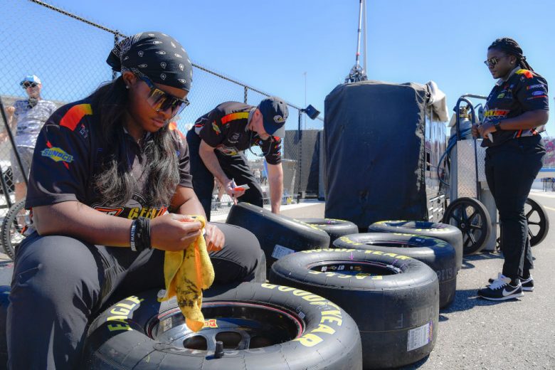 AVONDALE, ARIZONA - MARCH 12: Brehanna Daniels, tire changer for SS Green Light Racing works in the pit area during qualifying for the Ruoff Mortgage 500 at Phoenix Raceway on March 12, 2022 in Avondale, Arizona. (Photo by Logan Riely/Getty Images) | Getty Images