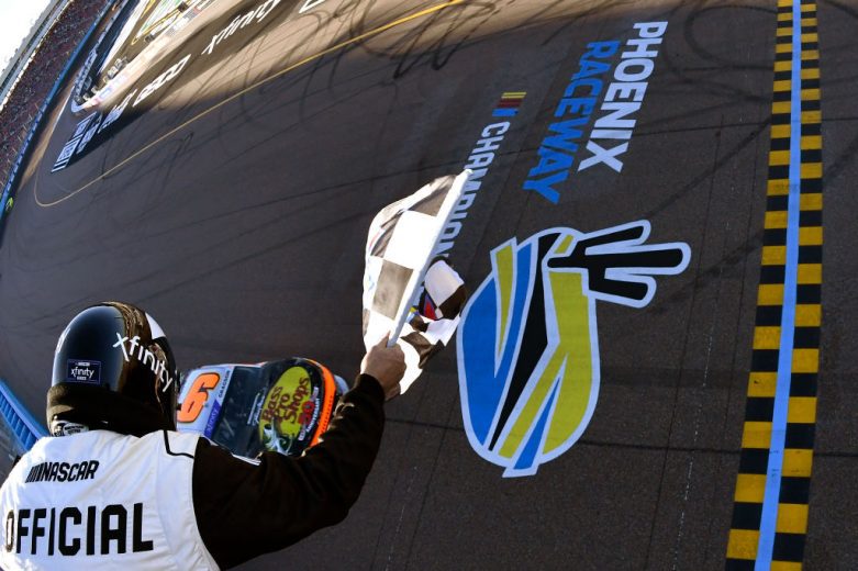 AVONDALE, ARIZONA - MARCH 12: Noah Gragson, driver of the #9 Bass Pro Shops/TrueTimber/BRCC Chevrolet, takes the checkered flag to win the NASCAR Xfinity Series United Rentals 200 at Phoenix Raceway on March 12, 2022 in Avondale, Arizona. (Photo by Logan Riely/Getty Images) | Getty Images
