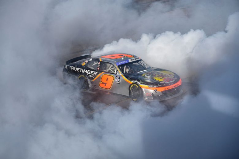 AVONDALE, ARIZONA - MARCH 12: Noah Gragson, driver of the #9 Bass Pro Shops/TrueTimber/BRCC Chevrolet, celebrates with a burnout after winning the NASCAR Xfinity Series United Rentals 200 at Phoenix Raceway on March 12, 2022 in Avondale, Arizona. (Photo by Logan Riely/Getty Images) | Getty Images