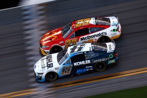 DAYTONA BEACH, FLORIDA - FEBRUARY 20: Brad Keselowski, driver of the #6 Kohler Generators Ford, and Bubba Wallace, driver of the #23 McDonald's Toyota, race during the NASCAR Cup Series 64th Annual Daytona 500 at Daytona International Speedway on February 20, 2022 in Daytona Beach, Florida. (Photo by Jared C. Tilton/Getty Images) | Getty Images