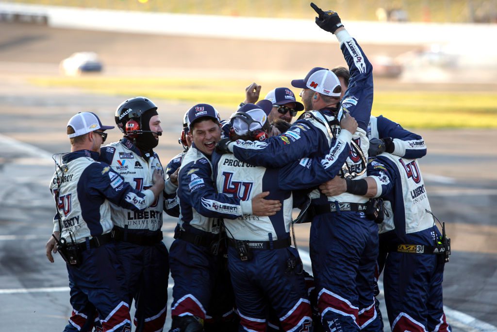 HAMPTON, GEORGIA - MARCH 20: The pit crew of the #24 Liberty University Chevrolet, celebrates after driver William Byron wins the NASCAR Cup Series Folds of Honor QuikTrip 500 at Atlanta Motor Speedway on March 20, 2022 in Hampton, Georgia. (Photo by Sean Gardner/Getty Images) | Getty Images