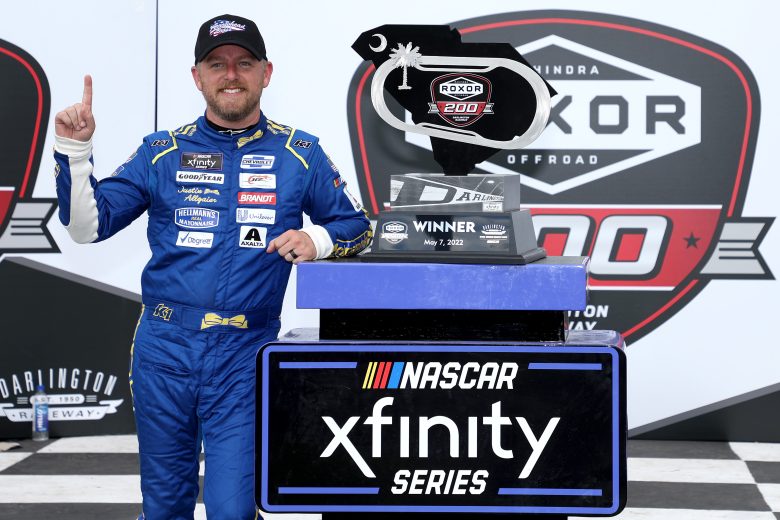 DARLINGTON, SOUTH CAROLINA - MAY 07: Justin Allgaier, driver of the #7 Hellmann's Chevrolet, celebrates in the Ruoff Mortgage victory lane after winning the NASCAR Xfinity Series Mahindra ROXOR 200 at Darlington Raceway on May 07, 2022 in Darlington, South Carolina. (Photo by James Gilbert/Getty Images) | Getty Images