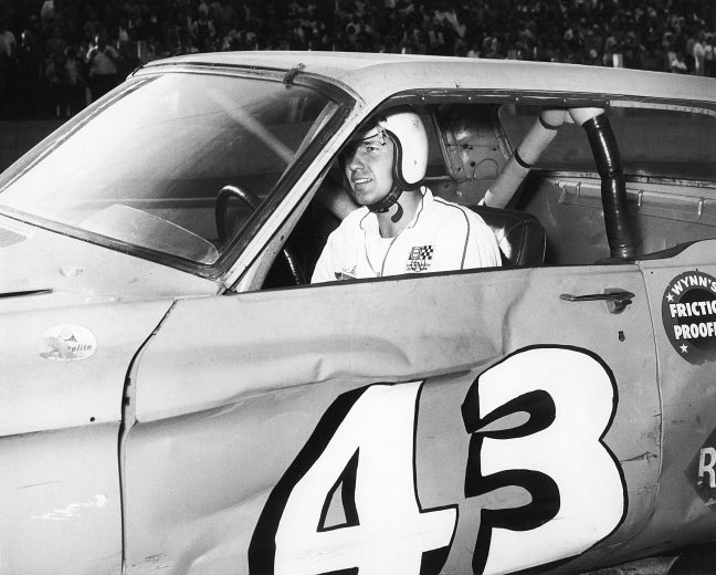 UNKNOWN — Early-1960s:  Richard Petty gets set to start a NASCAR Cup race in a car that has obviously already gotten a few battle scars from previous races.  (Photo by ISC Images & Archives via Getty Images)