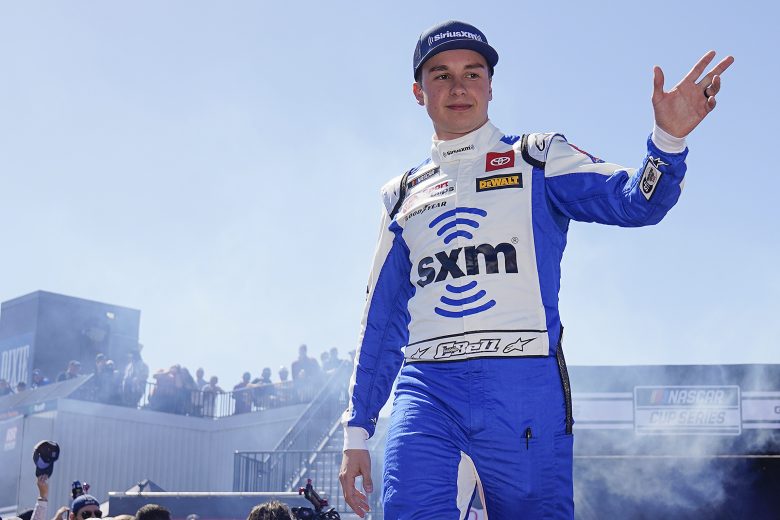 RICHMOND, VIRGINIA - APRIL 03: Christopher Bell, driver of the #20 SiriusXM Toyota, waves to fans onstage during driver intros prior to the NASCAR Cup Series Toyota Owners 400 at Richmond Raceway on April 03, 2022 in Richmond, Virginia. (Photo by Jacob Kupferman/Getty Images) | Getty Images