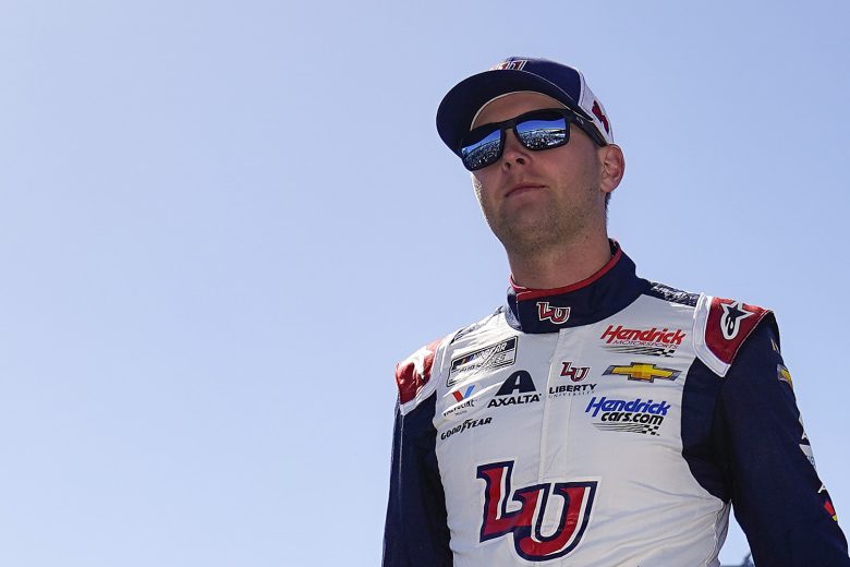 RICHMOND, VIRGINIA - APRIL 03: William Byron, driver of the #24 Liberty University Chevrolet, walks onstage during driver intros prior to the NASCAR Cup Series Toyota Owners 400 at Richmond Raceway on April 03, 2022 in Richmond, Virginia. (Photo by Jacob Kupferman/Getty Images) | Getty Images
