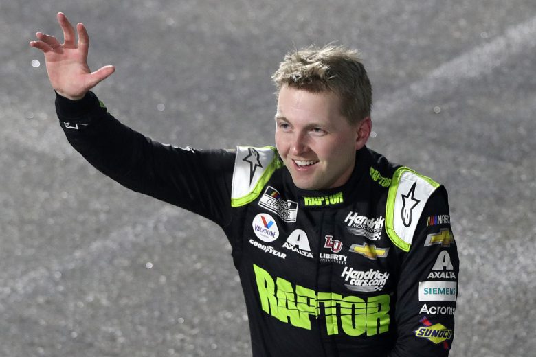 MARTINSVILLE, VIRGINIA - APRIL 09: William Byron, driver of the #24 RaptorTough.com Chevrolet, waves to fans after winning the NASCAR Cup Series Blue-Emu Maximum Pain Relief 400 at Martinsville Speedway on April 09, 2022 in Martinsville, Virginia. (Photo by Meg Oliphant/Getty Images) | Getty Images