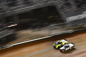 BRISTOL, TENNESSEE - APRIL 16: Matt Crafton, driver of the #88 Great Lakes Flooring/Menards Toyota, and Buddy Kofoid, driver of the #51 Mobil 1 Toyota, race during the NASCAR Camping World Truck Series Pinty's Truck Race on Dirt at Bristol Motor Speedway on April 16, 2022 in Bristol, Tennessee. (Photo by Logan Riely/Getty Images) | Getty Images
