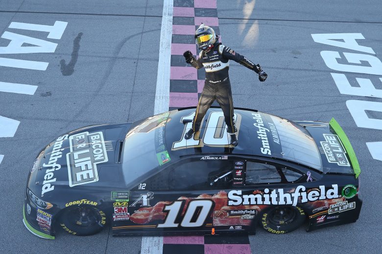 TALLADEGA, AL - OCTOBER 14: Aric Almirola, driver of the #10 Smithfield Bacon for Life Ford, celebrates after winning the Monster Energy NASCAR Cup Series 1000Bulbs.com 500 at Talladega Superspeedway on October 14, 2018 in Talladega, Alabama. (Photo by Matt Sullivan/Getty Images) | Getty Images
