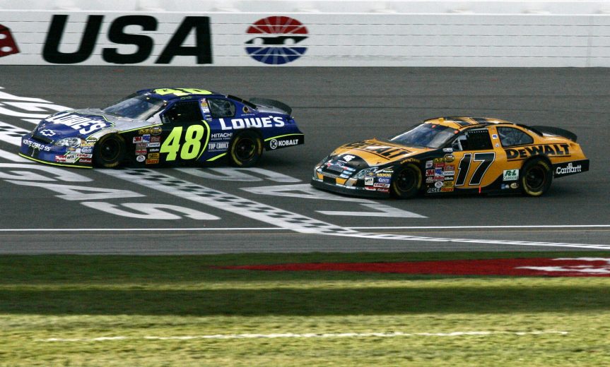 Jimmie Johnson and his #48 car win's in final lap of the UAW-DaimlerChrysler 400.Johnson crosses the finish line fractions of a second ahead of Matt Kenseth, at the Las Vegas Motor Speedway, Las Vegas, Nevada, March 12, 2006. (Photo by Warren Wimmer/Getty Images)