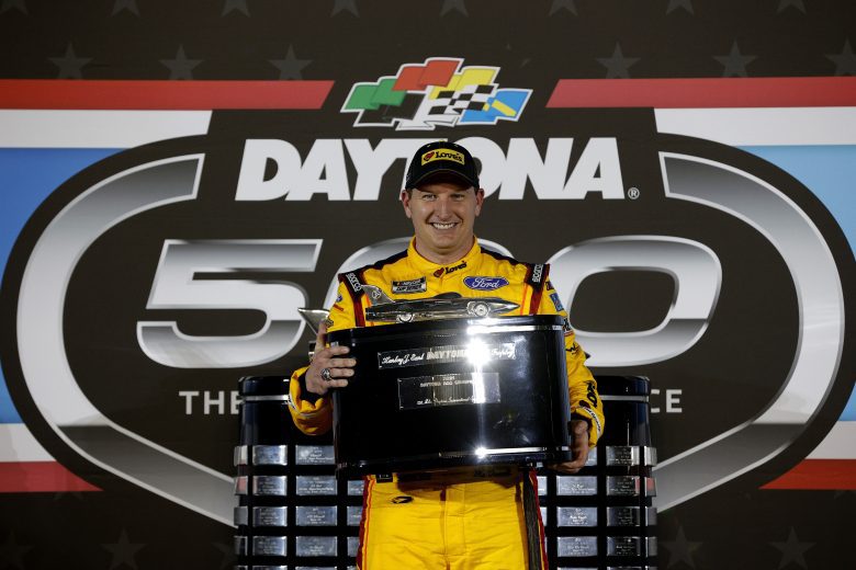 DAYTONA BEACH, FLORIDA - FEBRUARY 14: Michael McDowell, driver of the #34 Love's Travel Stops Ford, celebrates in victory lane after winning the NASCAR Cup Series 63rd Annual Daytona 500 at Daytona International Speedway on February 14, 2021 in Daytona Beach, Florida. (Photo by Chris Graythen/Getty Images) | Getty Images