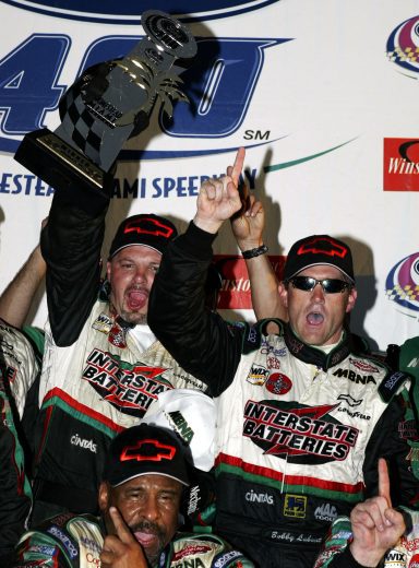HOMESTEAD,FL- NOVEMBER 16: Bobby Labonte, driver of the #18 Joe Gibbs Racing Interstate Batteries Chevrolet celebrates winning the NASCAR Winston Cup Ford 400, on November16, 2003 at Miami Dade Speedway in Homestead, Florida. (Photo By Darrell Ingham/Getty Images) | Getty Images