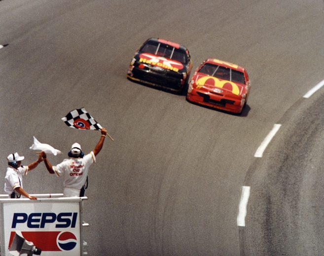 DAYTONA BEACH, FL - JULY 2, 1994: Jimmy Spencer (R) edged Ernie Irvan in the 1994 Pepsi 400 by .008 of a second, the fifth-closest in NASCAR history since the advent of computer scoring. It was the only lap Spencer led in the race, and served as his first NASCAR Cup Series win. (Photo by ISC Archives/CQ-Roll Call Group via Getty Images)