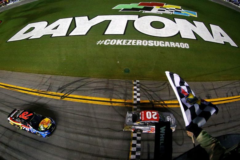 DAYTONA BEACH, FL - JULY 07: Erik Jones, driver of the #20 buyatoyota.com Toyota, takes the checkered flag to win the Monster Energy NASCAR Cup Series Coke Zero Sugar 400 at Daytona International Speedway on July 7, 2018 in Daytona Beach, Florida. (Photo by Sarah Crabill/Getty Images) | Getty Images