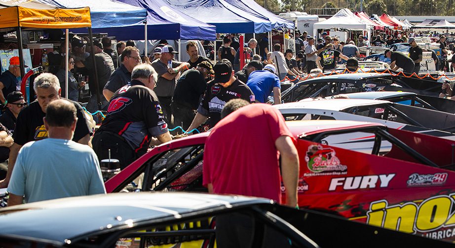 A general view of the garage area during practice for the New Smyrna Visitors Bureau 200 for the NASCAR Whelen Modified Tour during night 2 of the World Series of Asphalt Stock Car Racing at New Smyrna Speedway in New Smyrna, Florida on February 12, 2022. (Adam Glanzman/NASCAR)
