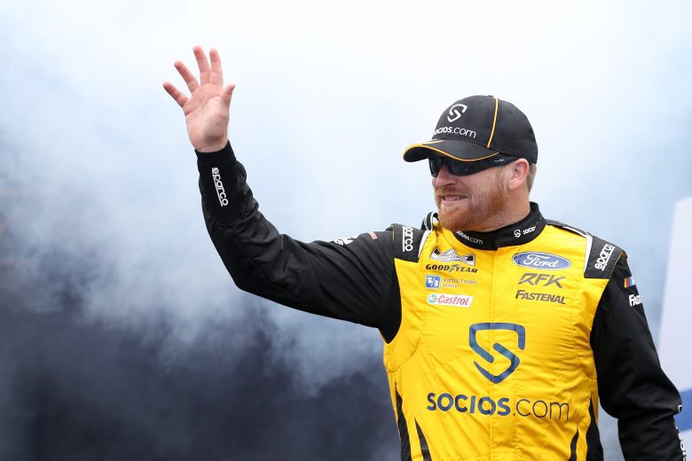 DARLINGTON, SOUTH CAROLINA - MAY 08: Chris Buescher, driver of the #17 Socios.com Ford, waves to fans as he walks onstage during driver intros prior to the NASCAR Cup Series Goodyear 400 at Darlington Raceway on May 08, 2022 in Darlington, South Carolina. (Photo by James Gilbert/Getty Images) | Getty Images