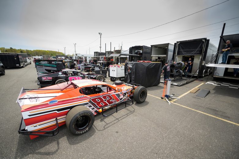 The Dannys Cesspool Service/Riverhead Building Supply car and others in the pit area during the Miller Lite 200 for the Whelen Modified Tour at Riverhead Raceway on May 14, 2022 in Riverhead, New York. (Mike Lawrence/NASCAR)