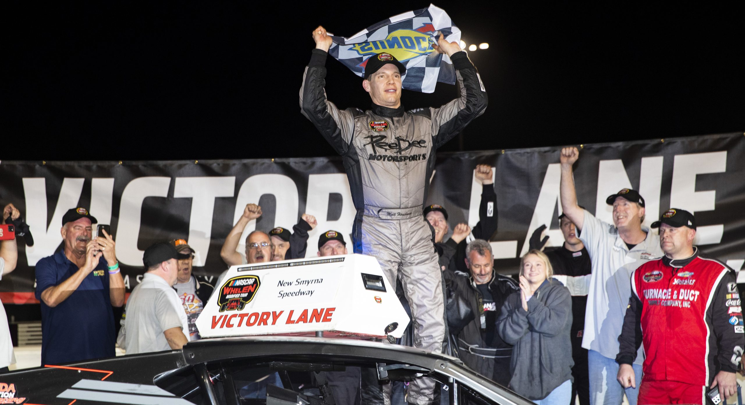 Matt Hirschman, driver of the #60 PeeDee Motorsports Car, celebrates in victory lane during the New Smyrna Visitors Bureau 200 for the NASCAR Whelen Modified Tour during night 2 of the World Series of Asphalt Stock Car Racing at New Smyrna Speedway in New Smyrna, Florida on February 12, 2022. (Adam Glanzman/NASCAR)