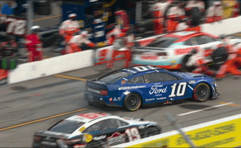Close quarters on the narrow pit road.