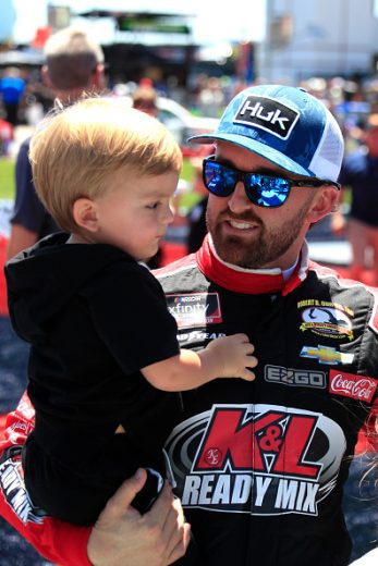 CHARLOTTE, NC - MAY 28: Austin Dillon (#48 Big Machine Racing Spiked Coolers Chevrolet) with son Ace prior to the running of the NASCAR Xfinity Series Alsco Uniforms 300 on May 28, 2022 at Charlotte Motor Speedway in Charlotte, NC. (Photo by Jeff Robinson/Icon Sportswire via Getty Images)