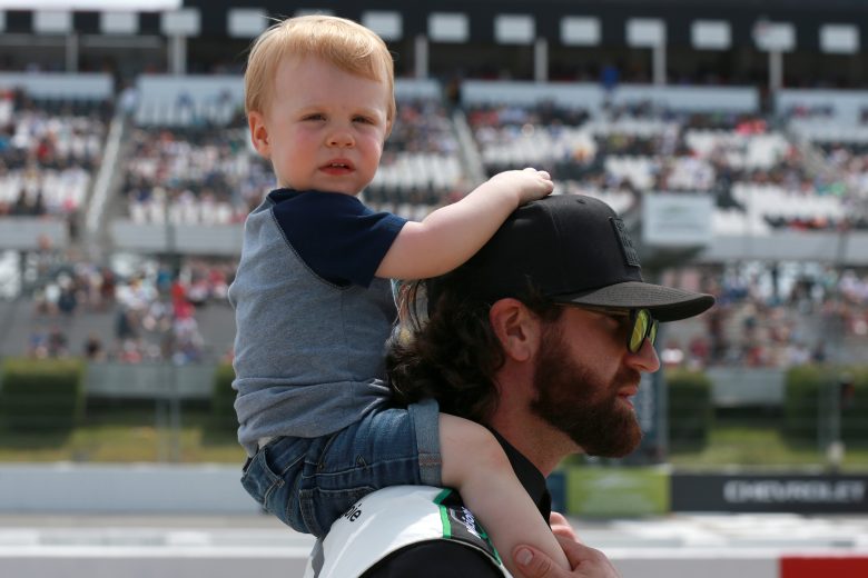 LONG POND, PENNSYLVANIA - JUNE 26: Corey LaJoie, driver of the #7 Nations Guard Chevrolet, and son, Levi walk the grid the NASCAR Cup Series Pocono Organics CBD 325 at Pocono Raceway on June 26, 2021 in Long Pond, Pennsylvania. (Photo by Sean Gardner/Getty Images) | Getty Images