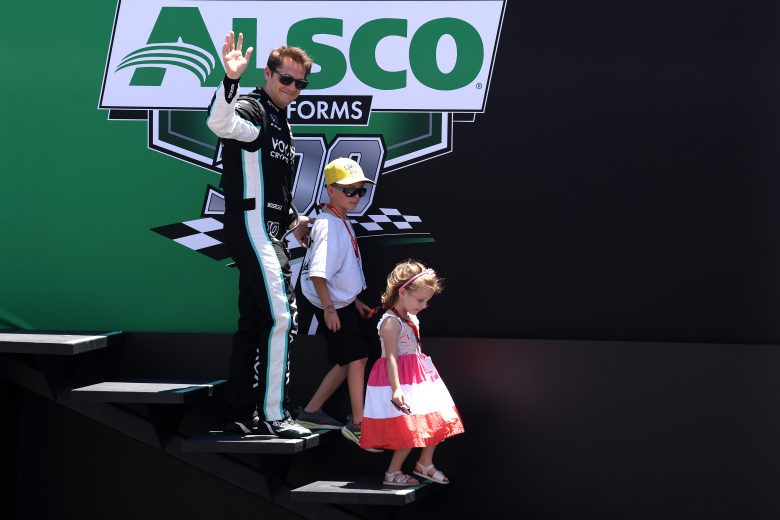 CONCORD, NORTH CAROLINA - MAY 28: Landon Cassill, driver of the #10 Voyager: Crypto for All Chevrolet, waves to fans as he walks onstage during driver intros prior to the NASCAR Xfinity Series Alsco Uniforms 300 at Charlotte Motor Speedway on May 28, 2022 in Concord, North Carolina. (Photo by James Gilbert/Getty Images) | Getty Images
