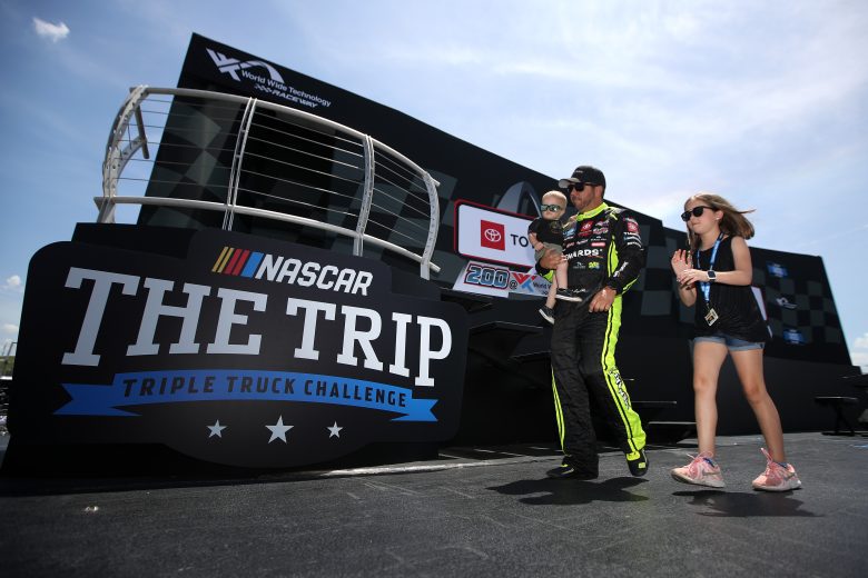 MADISON, ILLINOIS - JUNE 04: Matt Crafton, driver of the #88 Paslode/Menards Toyota, walks onstage with daughter Elladee and son Matthew during driver intros prior to the NASCAR Camping World Truck Series Toyota 200 at WWT Raceway on June 04, 2022 in Madison, Illinois. (Photo by Sean Gardner/Getty Images) | Getty Images