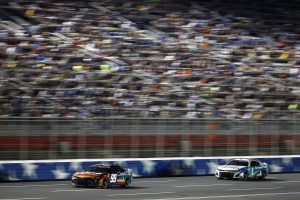 CONCORD, NORTH CAROLINA - MAY 29: Daniel Suarez, driver of the #99 CommScope Chevrolet, and Ross Chastain, driver of the #1 Advent Health Chevrolet, race during the NASCAR Cup Series Coca-Cola 600 at Charlotte Motor Speedway on May 29, 2022 in Concord, North Carolina. (Photo by Jared C. Tilton/Getty Images) | Getty Images