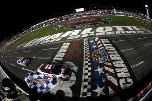 CONCORD, NORTH CAROLINA - MAY 29: Denny Hamlin, driver of the #11 FedEx Ground Toyota, takes the checkered flag to win the NASCAR Cup Series Coca-Cola 600 at Charlotte Motor Speedway on May 29, 2022 in Concord, North Carolina. (Photo by James Gilbert/Getty Images) | Getty Images