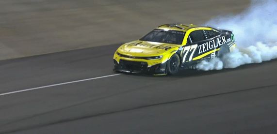 No, this isn’t a victory burnout. An expired engine with 10 laps to go will set up for a fascinating finish.