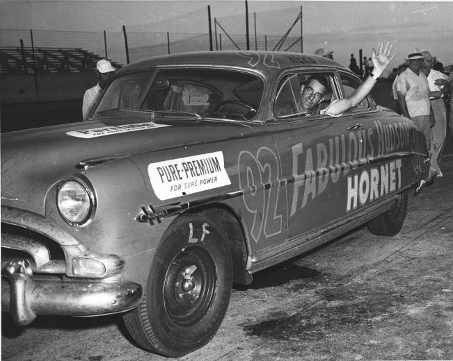 1952: Herb Thomas waves from the window of his Fabulous Hudson Hornet after battling in another NASCAR event. (Photo by ISC Archives/CQ-Roll Call Group via Getty Images)