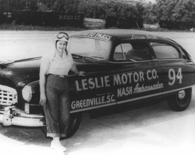 HILLSBORO, NC - OCTOBER 29, 1950: Louise Smith next to the Leslie Motor Co. '50 Nash at Occoneechee Speedway, where she finished 19th in the 200-miler. (Photo by ISC Archives/CQ-Roll Call Group via Getty Images)