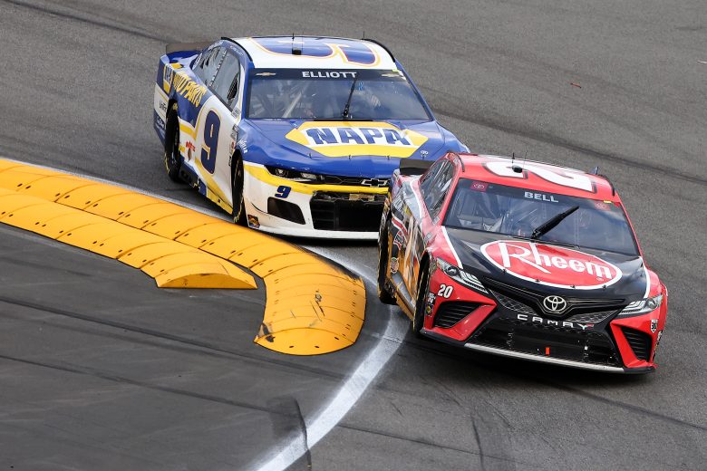 Christopher Bell leads Chase Elliott into a turn