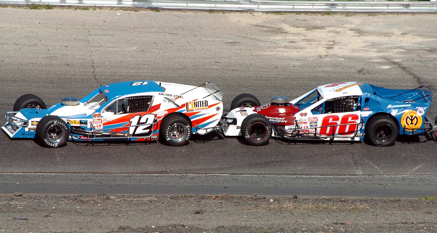 Jimmy Blewett (12) leads brother John Blewett III during a NASCAR Whelen Modified Tour event at Wall Stadium Speedway in Wall Township, New Jersey, on May 6, 2007. (Photo: NASCAR)