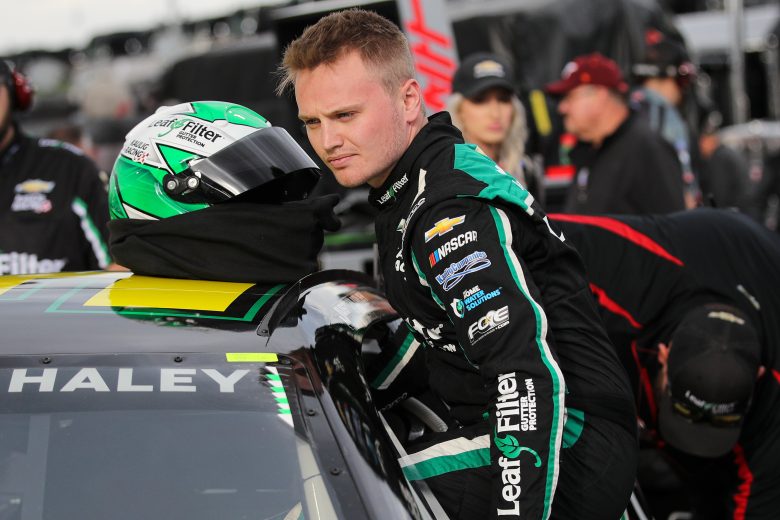 MARTINSVILLE, VIRGINIA - APRIL 08: Justin Haley, driver of the #31 LeafFilter Gutter Protection Chevrolet, enters his car during qualifying for the NASCAR Cup Series Blue-Emu Maximum Pain Relief 400 at Martinsville Speedway on April 08, 2022 in Martinsville, Virginia. (Photo by Meg Oliphant/Getty Images) | Getty Images