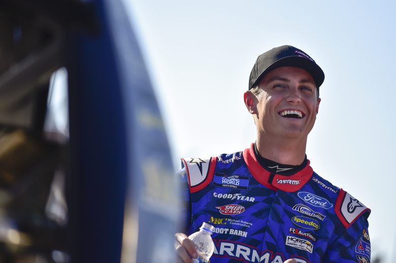 MADISON, ILLINOIS - JUNE 03: Zane Smith, driver of the #38 ARRMA RC Ford, shares a laugh on the grid during qualifying for the NASCAR Camping World Truck Series Toyota 200 at WWT Raceway on June 03, 2022 in Madison, Illinois. (Photo by Jeff Curry/Getty Images) | Getty Images