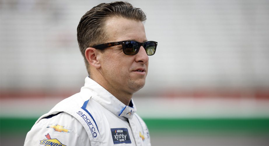 AJ Allmendinger walks on pit road.