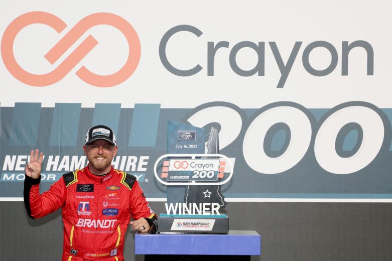 Justin Allgaier poses with the trophy.