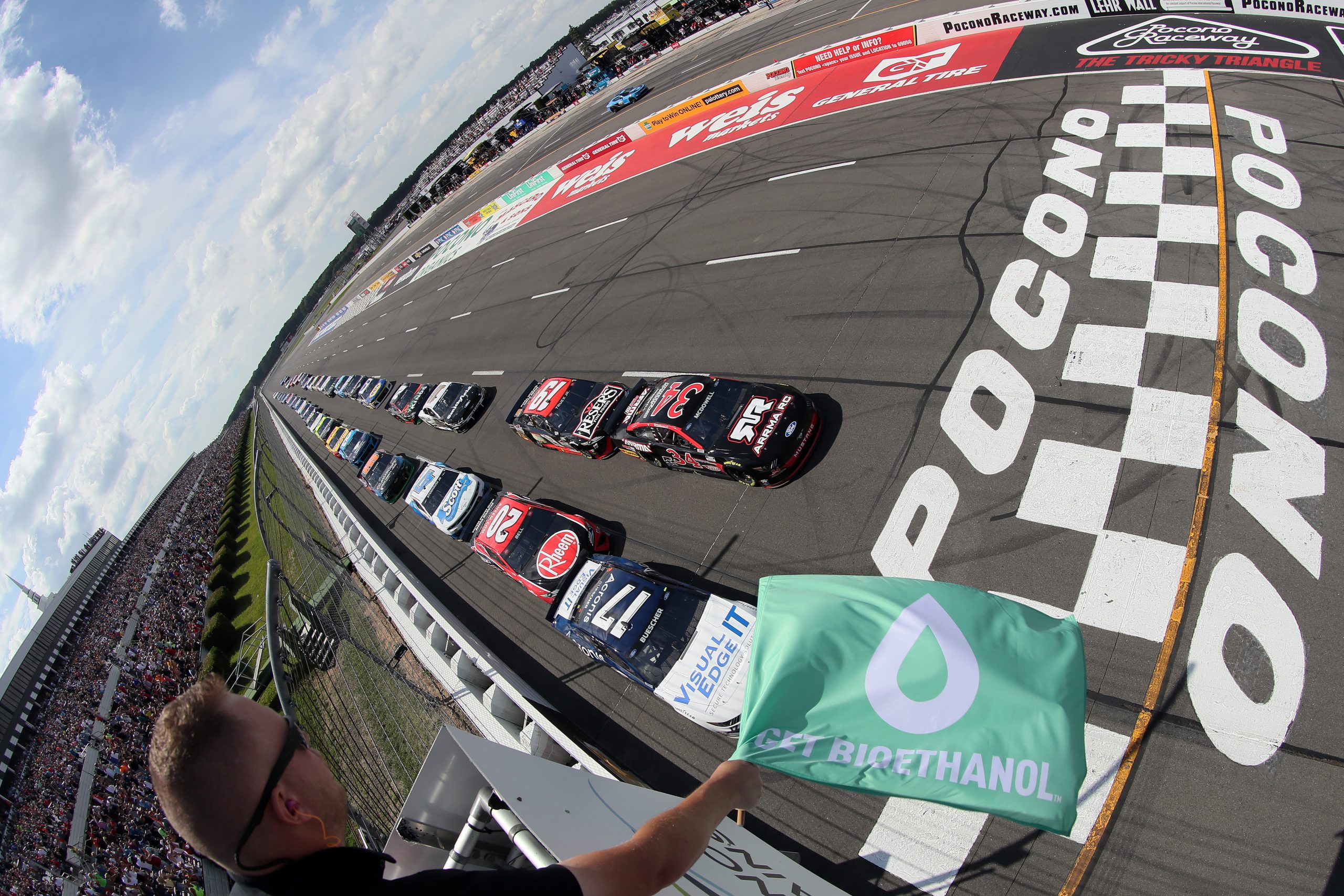 Cars race to the green flag at Pocono