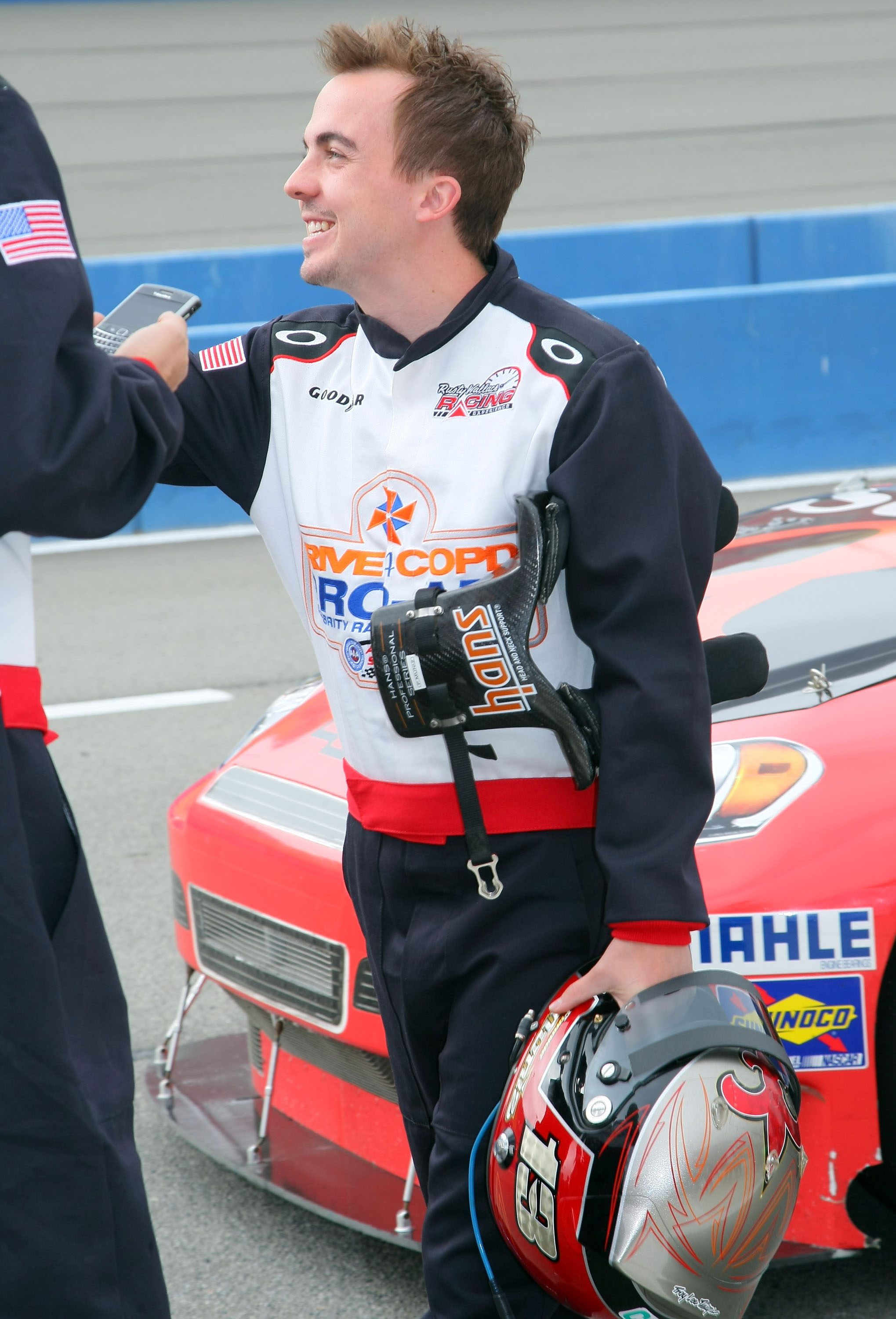 FONTANA, CA - MARCH 23: Actor Frankie Muniz waits on pit road during DRIVE4COPD Pro-Am Celebrity Racing at Auto Club Speedway on March 23, 2012 in Fontana, California. (Photo by Victor Decolongon/Getty Images for the COPD Foundation) | Getty Images