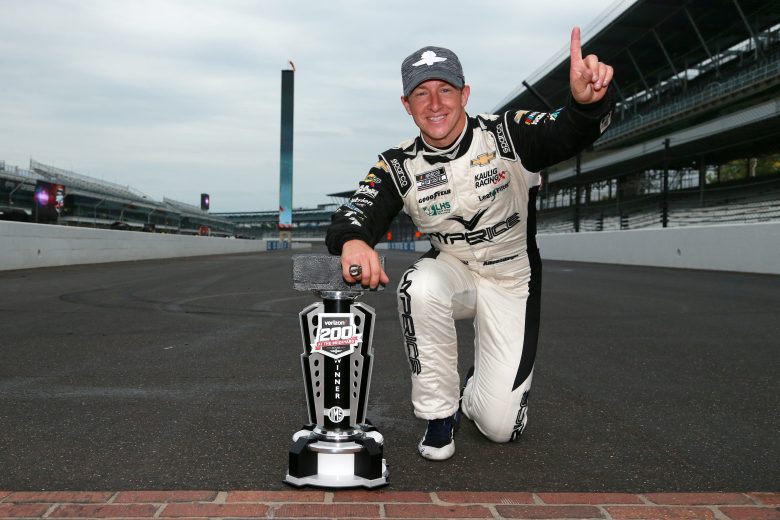 INDIANAPOLIS, INDIANA - AUGUST 15: AJ Allmendinger, driver of the #16 Hyperice Chevrolet, celebrates on the yard of bricks after winning the NASCAR Cup Series Verizon 200 at the Brickyard at Indianapolis Motor Speedway on August 15, 2021 in Indianapolis, Indiana. (Photo by Sean Gardner/Getty Images) | Getty Images