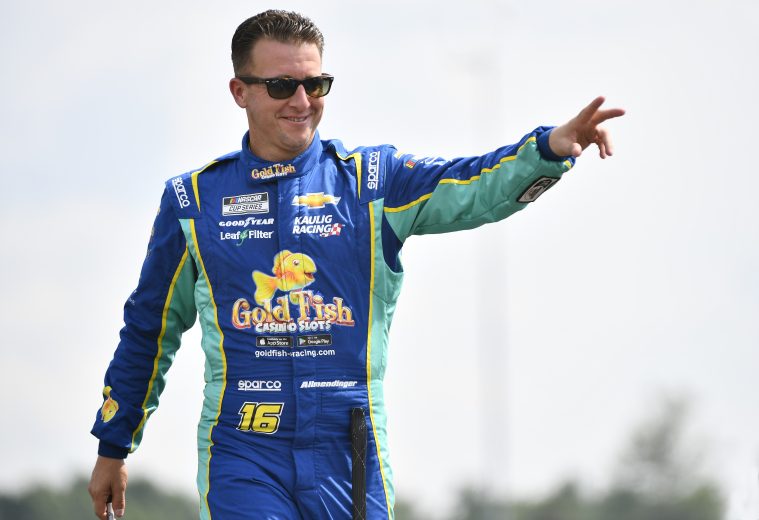 LEBANON, TENNESSEE - JUNE 26: AJ Allmendinger, driver of the #16 Gold Fish Casino Slots Chevrolet, waves to fans onstage during driver intros prior to the NASCAR Cup Series Ally 400 at Nashville Superspeedway on June 26, 2022 in Lebanon, Tennessee. (Photo by Logan Riely/Getty Images) | Getty Images