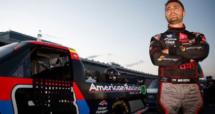 Ty Majeski stands outside his truck with arms crossed