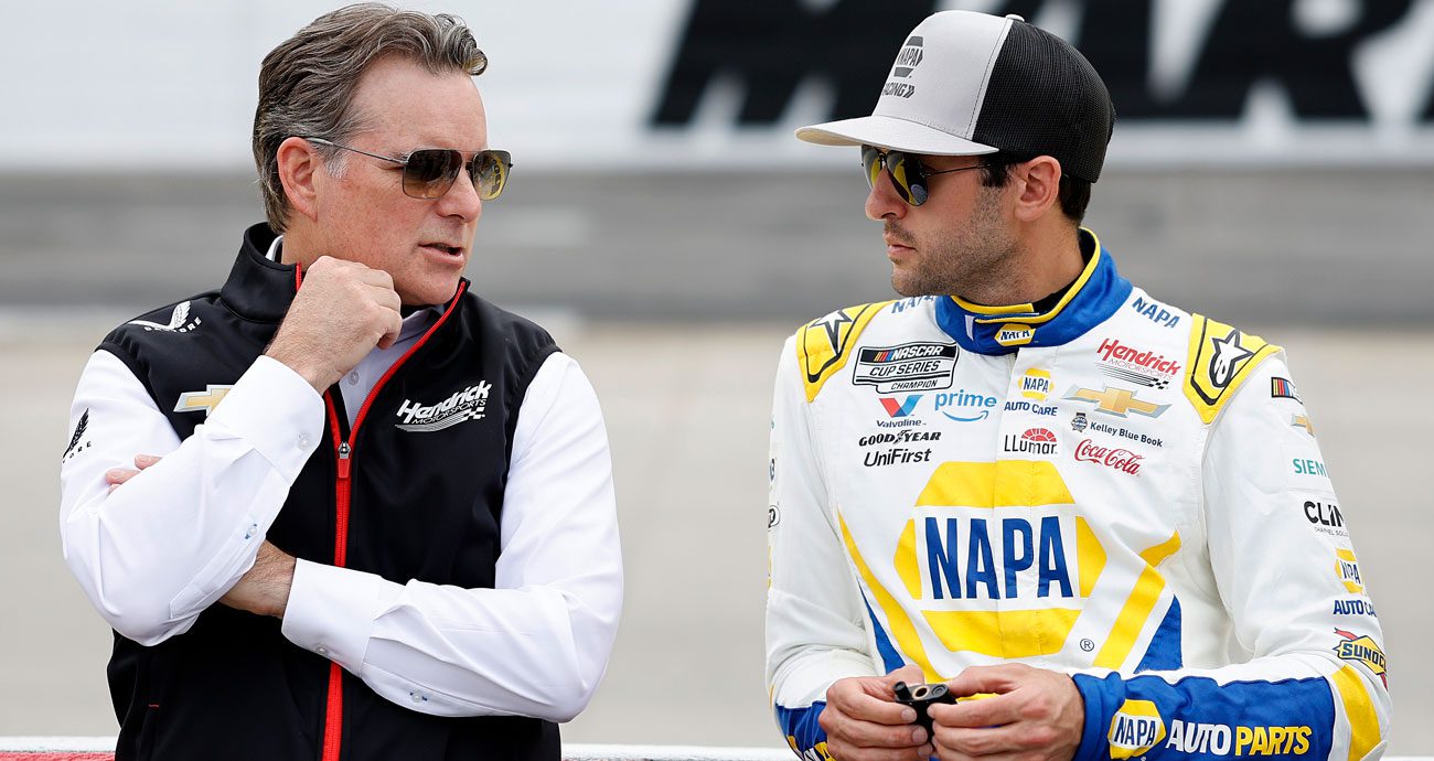 Jeff Gordon (L) and Chase Elliott (R) talk.