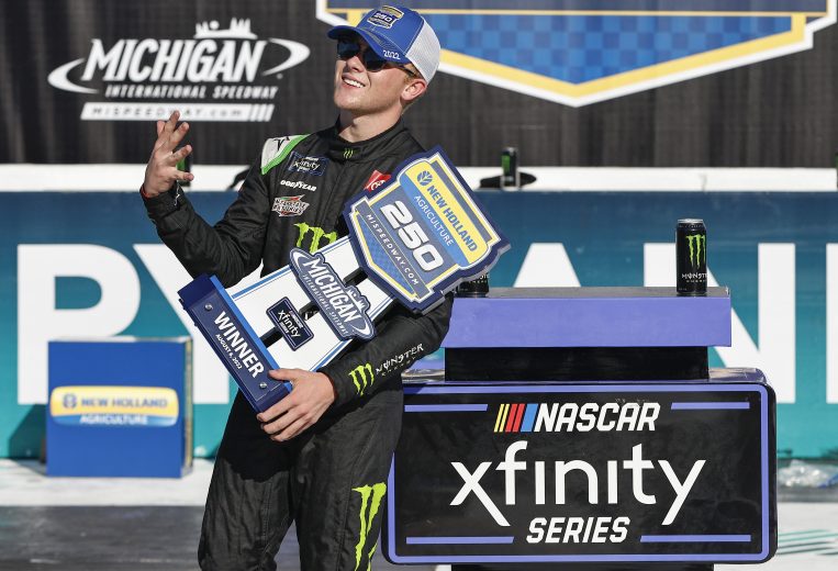 Ty Gibbs poses with the trophy after winning the Xfinity Series race at Michigan.