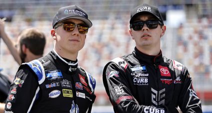 John Hunter Nemechek and Christian Eckes stand on pit road.