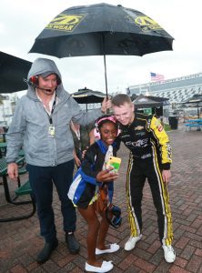 Justin Haley poses for a picture with a fan.