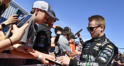 Justin Haley signs autographs for fans.