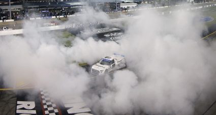Chandler Smith does a burnout for the fans.