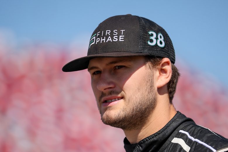 TALLADEGA, ALABAMA - APRIL 23: Todd Gilliland, driver of the #38 First Phase Credit Card Ford, walks the grid during qualifying for the NASCAR Cup Series GEICO 500 at Talladega Superspeedway on April 23, 2022 in Talladega, Alabama. (Photo by James Gilbert/Getty Images) | Getty Images